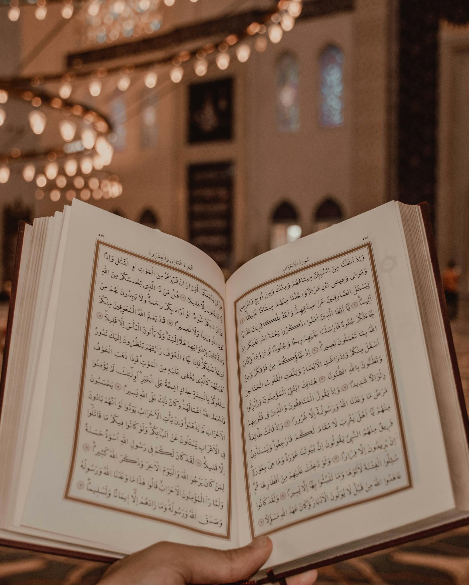 Islam scripture in Arabic language in person hand